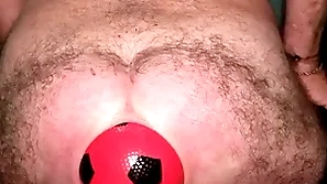 World record 13 cm wide anal stretching with inflatable ball.